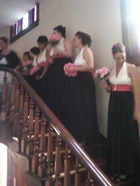 Hot pink Bridal party on the vintage double staircase at The Olde North wedding Chapel, richmond indiana wedding ceremony site.