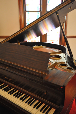 Vintage Baby Grand Piano at the historic Olde North Chapel, Indiana wedding ceremony site.